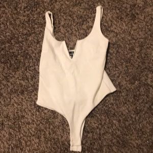 Never worn Lulu’s white body suit